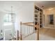 Open foyer with chandelier, view to front door and built-in bookshelves at 4096 Vinings Mill Se Trl, Smyrna, GA 30080