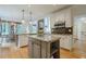 Bright kitchen features a center island, stainless steel appliances, and seamless flow to the dining area at 4096 Vinings Mill Se Trl, Smyrna, GA 30080