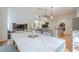 Open kitchen with a large island, modern appliances, and seamless flow to the dining area at 4096 Vinings Mill Se Trl, Smyrna, GA 30080