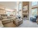Bright living room features a stone fireplace, large windows, and an open layout at 4096 Vinings Mill Se Trl, Smyrna, GA 30080
