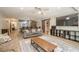 Basement open floor plan featuring a grey couch, bar, kitchen, and dining area at 4096 Vinings Mill Se Trl, Smyrna, GA 30080