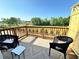 Cozy balcony with outdoor seating, perfect for enjoying the view and sunshine at 534 Sawnee Village Blvd # D65, Cumming, GA 30040