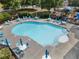 Community pool with ample seating and lounge chairs around the deck, as well as a playground at 5828 Paliser Trce, Sugar Hill, GA 30518