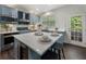 Beautiful kitchen with stainless steel appliances, quartz countertops, gray cabinets, and a center island at 5828 Paliser Trce, Sugar Hill, GA 30518
