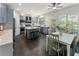 Stylish kitchen with a center island, bar stool seating and a breakfast nook with a view of the outdoor deck at 5828 Paliser Trce, Sugar Hill, GA 30518