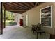 Outdoor patio area with a covered ceiling, privacy fence and outdoor furniture at 5828 Paliser Trce, Sugar Hill, GA 30518