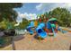 Fun community playground with colorful slides, climbing structures, and soft landing surface under a sunny sky at 5828 Paliser Trce, Sugar Hill, GA 30518