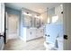 Modern bathroom features a double sink vanity, updated fixtures and a glass enclosed shower at 219 Poplar Nw St, Lilburn, GA 30047
