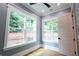 Bedroom with natural light from two large windows at 219 Poplar Nw St, Lilburn, GA 30047