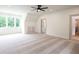Bedroom features a ceiling fan and natural light at 219 Poplar Nw St, Lilburn, GA 30047