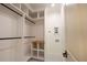 Organized closet with custom shelving and hanging rods for ample storage, ensuring neat organization at 219 Poplar Nw St, Lilburn, GA 30047