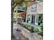 Lilburn Old Town shops with brick sidewalks, colorful planters and flower boxes, adding curb appeal at 219 Poplar Nw St, Lilburn, GA 30047