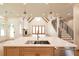 Modern kitchen featuring a spacious island, open floor plan, and abundant natural light at 219 Poplar Nw St, Lilburn, GA 30047