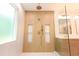 Modern shower with rainfall shower head and built-in shampoo niche at 219 Poplar Nw St, Lilburn, GA 30047