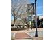 Street view of Old Town Lilburn with brick sidewalks, black lampposts, and banners in a charming, walkable neighborhood at 219 Poplar Nw St, Lilburn, GA 30047