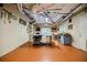 Basement workshop with an organized layout featuring equipment and a bright window for natural light at 3030 Spalding Dr, Sandy Springs, GA 30350