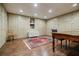 Finished basement featuring built-in storage, wood floors, and charming decor with a book collection at 3030 Spalding Dr, Sandy Springs, GA 30350