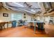 Basement workshop with exposed ducts featuring equipment and tools in a spacious area with bright lighting at 3030 Spalding Dr, Sandy Springs, GA 30350