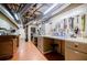 Spacious basement workshop area with organized tools, a workbench, and wood-paneled walls for a functional space at 3030 Spalding Dr, Sandy Springs, GA 30350