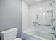Modern bathroom featuring a shower/tub with white subway tile surround and a glass partition at 3030 Spalding Dr, Sandy Springs, GA 30350