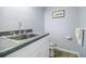 Small half bath features a sink and toilet at 3030 Spalding Dr, Sandy Springs, GA 30350