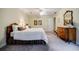 Bedroom with two beds, neutral carpet, traditional dresser and overhead fan at 3030 Spalding Dr, Sandy Springs, GA 30350