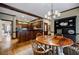 A cozy dining area with wooden table, hardwood floors, a hutch, and easy access to the kitchen at 3030 Spalding Dr, Sandy Springs, GA 30350