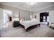 Spacious main bedroom features neutral carpet, ensuite access, and a view into the sitting room at 3030 Spalding Dr, Sandy Springs, GA 30350