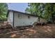 Back of house, showing deck and mature trees at 5640 Redan Cir, Stone Mountain, GA 30088