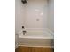 Bathroom featuring shower and new white tile at 5640 Redan Cir, Stone Mountain, GA 30088