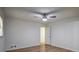 Bright bedroom with hardwood floors, a ceiling fan, and a window view at 5640 Redan Cir, Stone Mountain, GA 30088