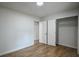 Bedroom featuring hardwood floors, ensuite bathroom, and a walk in closet at 5640 Redan Cir, Stone Mountain, GA 30088