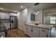 Kitchen featuring white cabinets, stainless steel appliances, and an island with granite countertops at 5640 Redan Cir, Stone Mountain, GA 30088