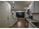Modern kitchen featuring granite countertops, stainless steel appliances, and white cabinetry at 5640 Redan Cir, Stone Mountain, GA 30088
