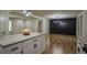 Open kitchen with granite island countertop and view into dining area with modern lighting at 5640 Redan Cir, Stone Mountain, GA 30088