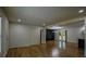 Spacious living area showcasing stylish wood floors, an open layout, and access to the kitchen and outdoor patio at 5640 Redan Cir, Stone Mountain, GA 30088