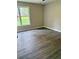 Bright bedroom with a large window and modern flooring offers a comfortable and airy retreat at 6103 Chaseland Dr, Rex, GA 30273