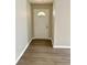 Clean and bright entryway showcasing the front door, flooring, and neutral walls at 6103 Chaseland Dr, Rex, GA 30273