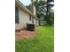 A view of the side yard, chimney, and the home's exterior features at 6103 Chaseland Dr, Rex, GA 30273