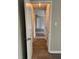 Hallway leading to other rooms with grey walls and laminate flooring at 6103 Chaseland Dr, Rex, GA 30273