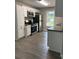 Well-equipped kitchen with stainless steel appliances, wood-look flooring, and neutral color scheme is move-in ready at 6103 Chaseland Dr, Rex, GA 30273