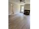 Inviting living room with fireplace, neutral paint, ceiling fan and ample natural light at 6103 Chaseland Dr, Rex, GA 30273