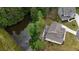 Aerial view of the home, landscaped yard, and pond at 783 Phil Haven Ln, Kennesaw, GA 30152