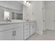 Bathroom featuring a double vanity with white cabinets and granite countertop and natural light at 783 Phil Haven Ln, Kennesaw, GA 30152