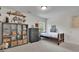 This bedroom features a storage unit, wood furniture, shelves, decor, and a cozy atmosphere at 783 Phil Haven Ln, Kennesaw, GA 30152