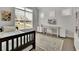 Cozy bedroom with natural light, decorative artwork, and shelving for storage at 783 Phil Haven Ln, Kennesaw, GA 30152