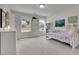 Bedroom featuring large windows, a bed, and a white dresser and a bookshelf at 783 Phil Haven Ln, Kennesaw, GA 30152