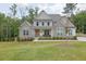 Charming two-story home with stone accents and a well-manicured lawn with plenty of trees at 783 Phil Haven Ln, Kennesaw, GA 30152