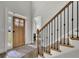 Welcoming foyer with hardwood floors, staircase with iron balusters, and a view to the front door at 783 Phil Haven Ln, Kennesaw, GA 30152