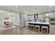 A spacious kitchen with island and barstools next to an eat-in area with fireplace creates a seamless flow at 783 Phil Haven Ln, Kennesaw, GA 30152